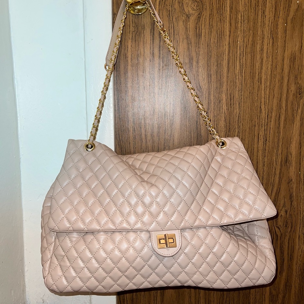 Large shoulder bag with chain strap.